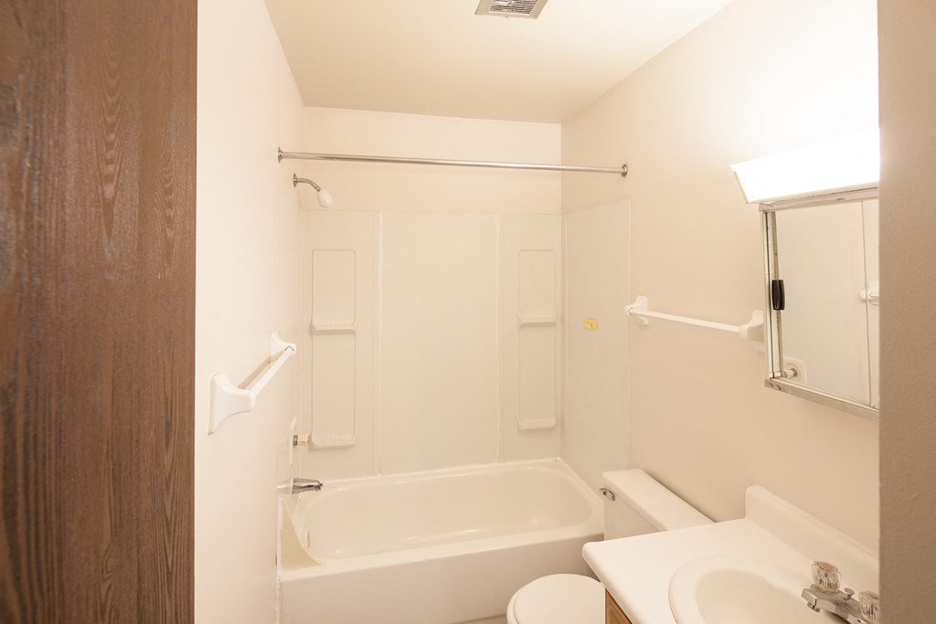 a bathroom with a sink toilet and a shower