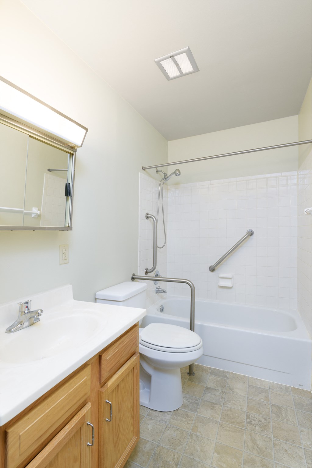 a bathroom with a toilet and a tub and a sink