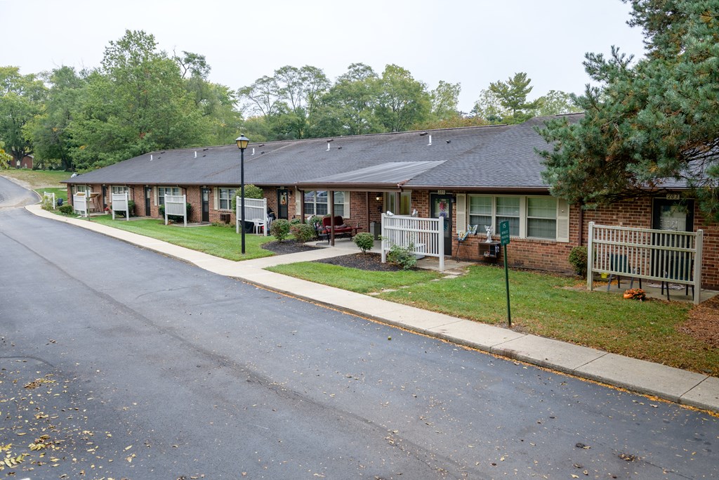 a street with a row of houses on the side of a road