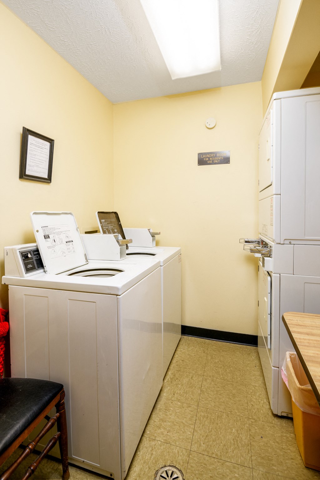 a kitchen with a washer and dryer and a refrigerator