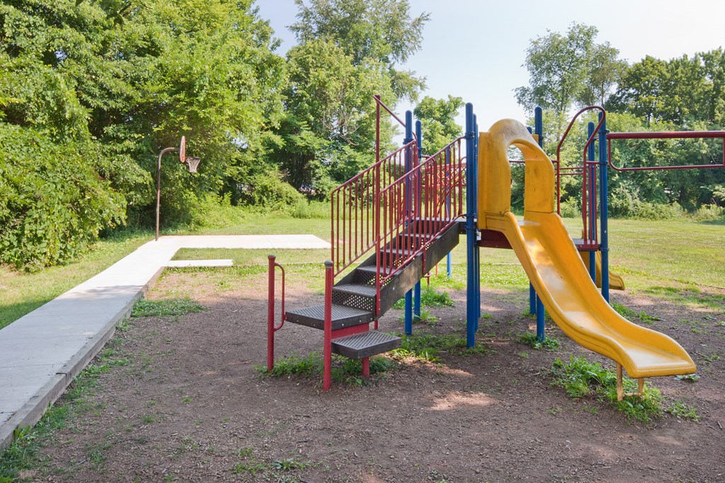 a playground with a slide and a staircase