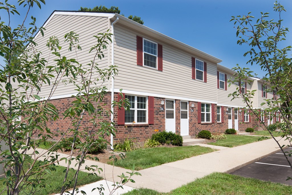 a brick and with a sidewalk in front of it