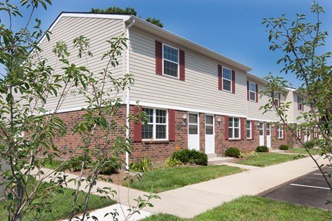 a brick and with a sidewalk in front of it