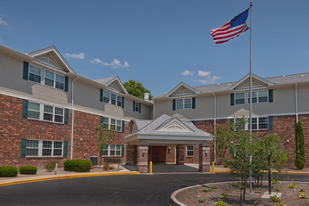 an flag flying in front of an apartment building