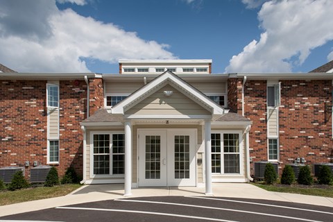 a large brick building with white doors and windows