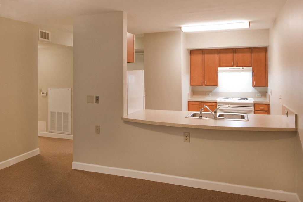 a view of a kitchen with a sink and a stove