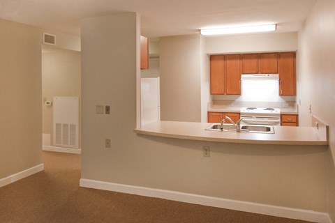 a view of a kitchen with a sink and a stove