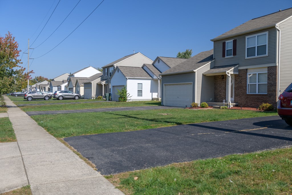 a row of houses on the side of a street