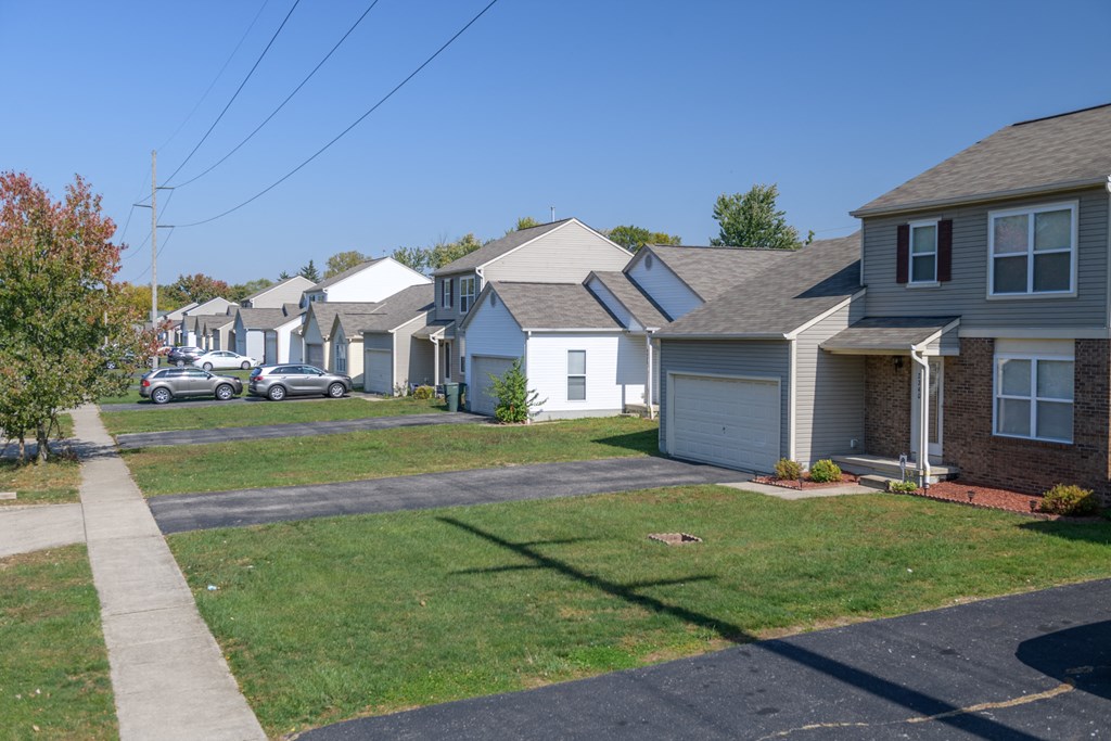 a row of houses on the side of a street