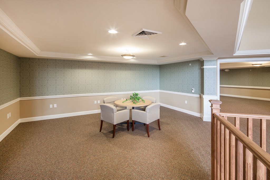 a dining room with a table and chairs