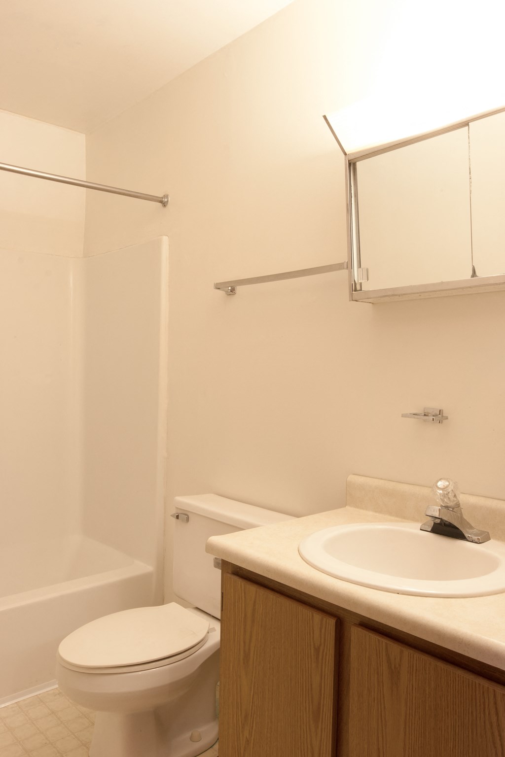 a small bathroom with a sink toilet and shower