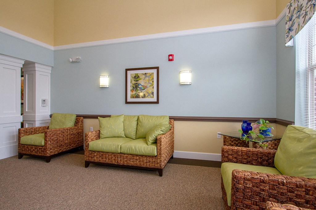 a living room with couches and chairs
