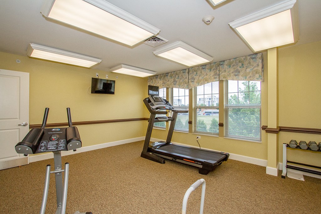 the preserve at ballantyne commons fitness room with treadmill and windows