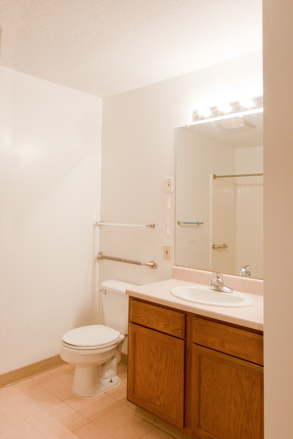 a small bathroom with a toilet sink and mirror