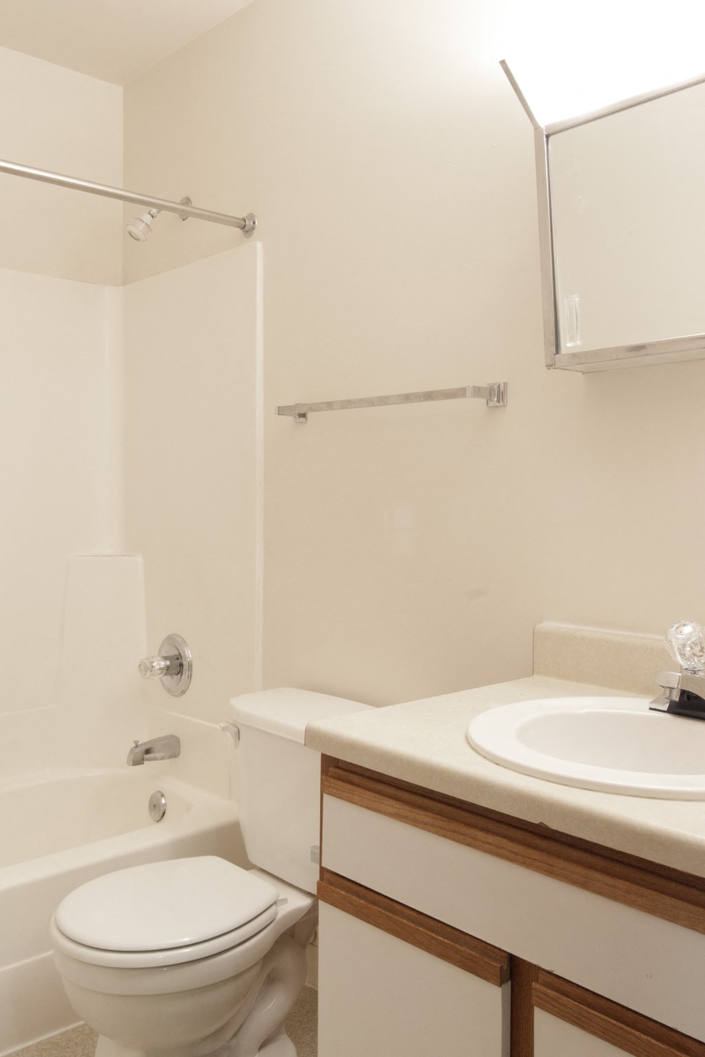 a small bathroom with a sink toilet and shower