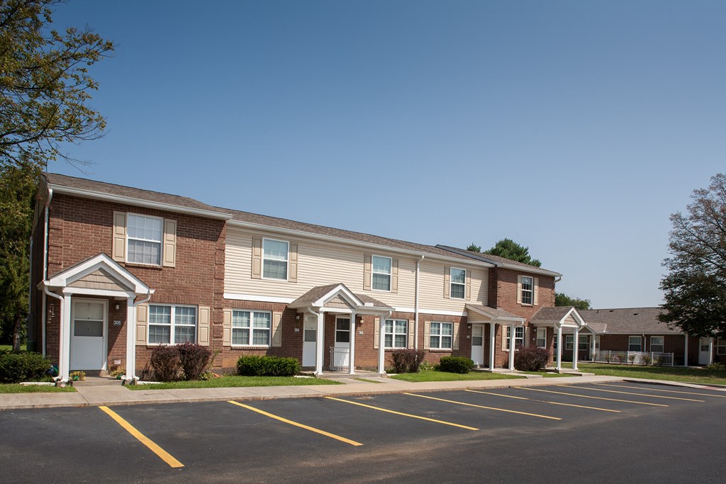 an apartment building with a parking lot
