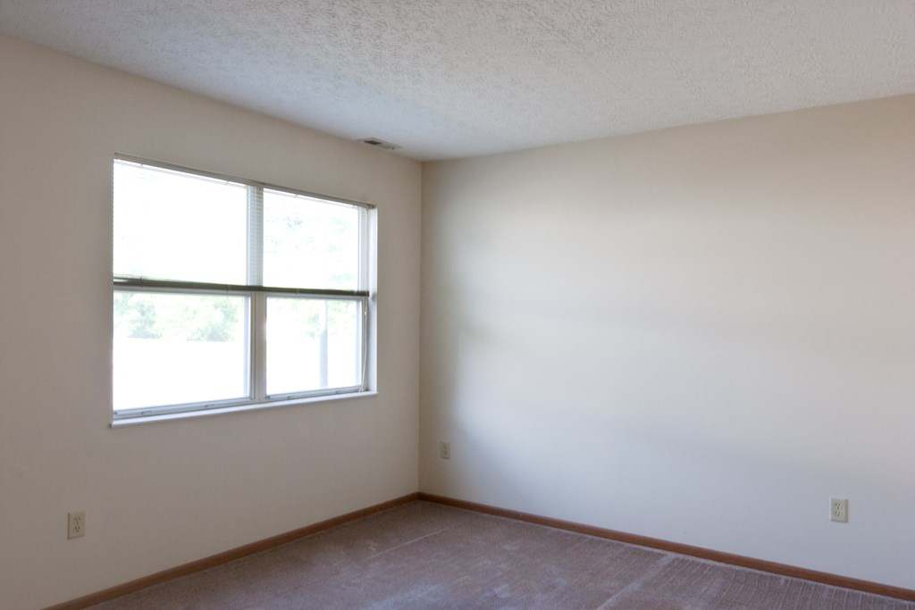 an empty room with a window in it