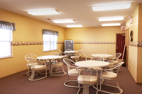 a dining room with tables and chairs