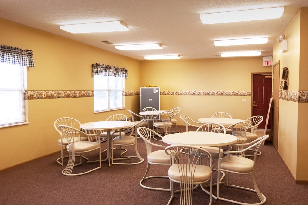 a dining room with tables and chairs