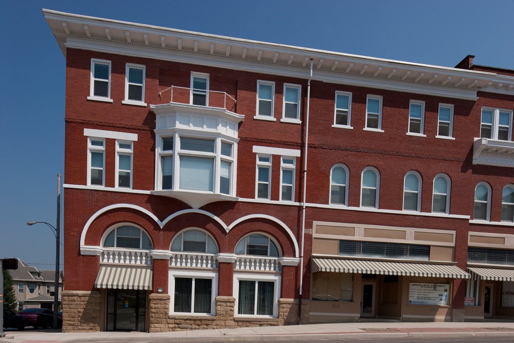 a red brick building on a city street