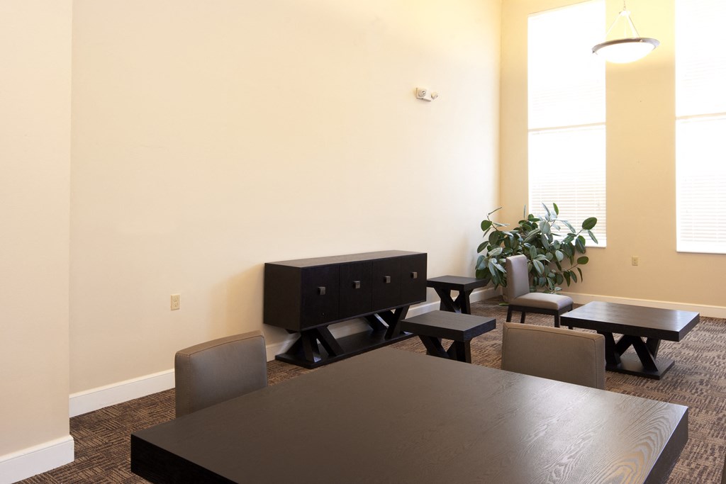 a dining room with a table and chairs and a tv