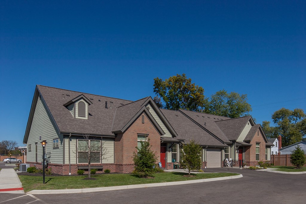 a house with a street corner in front of it