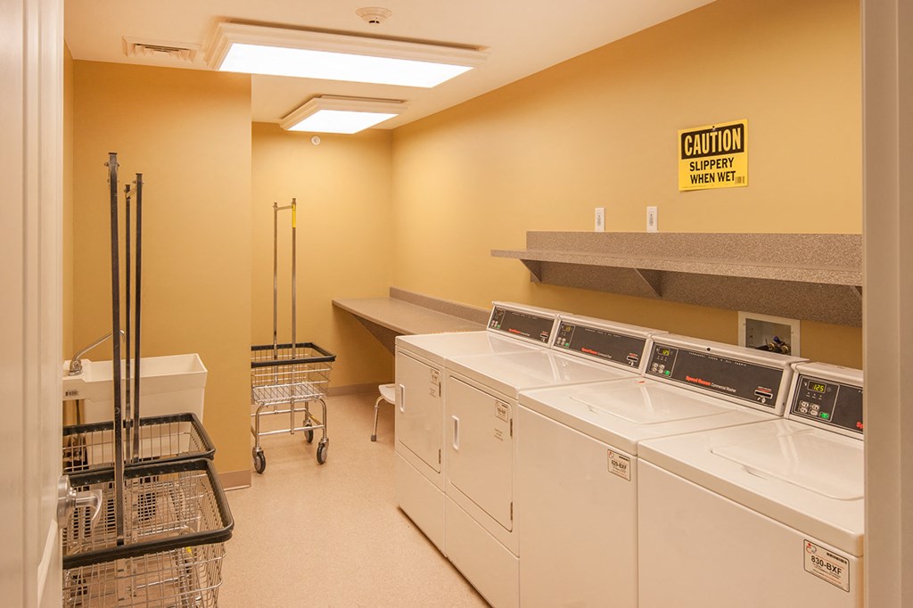 a washer and dryer area in a laundry room