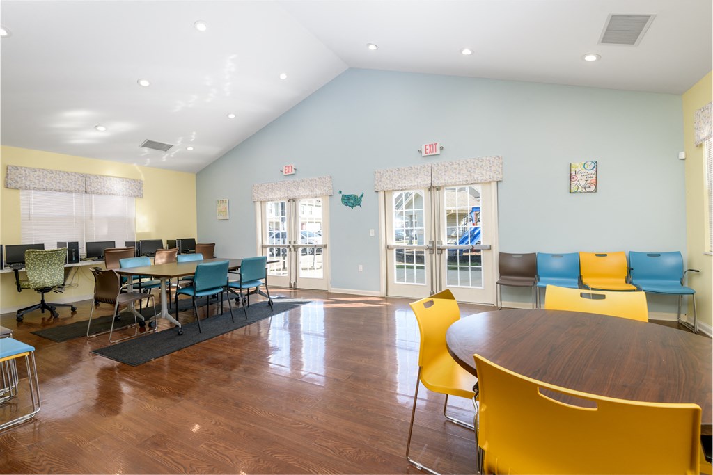 a dining room with tables and chairs and a table and chairs