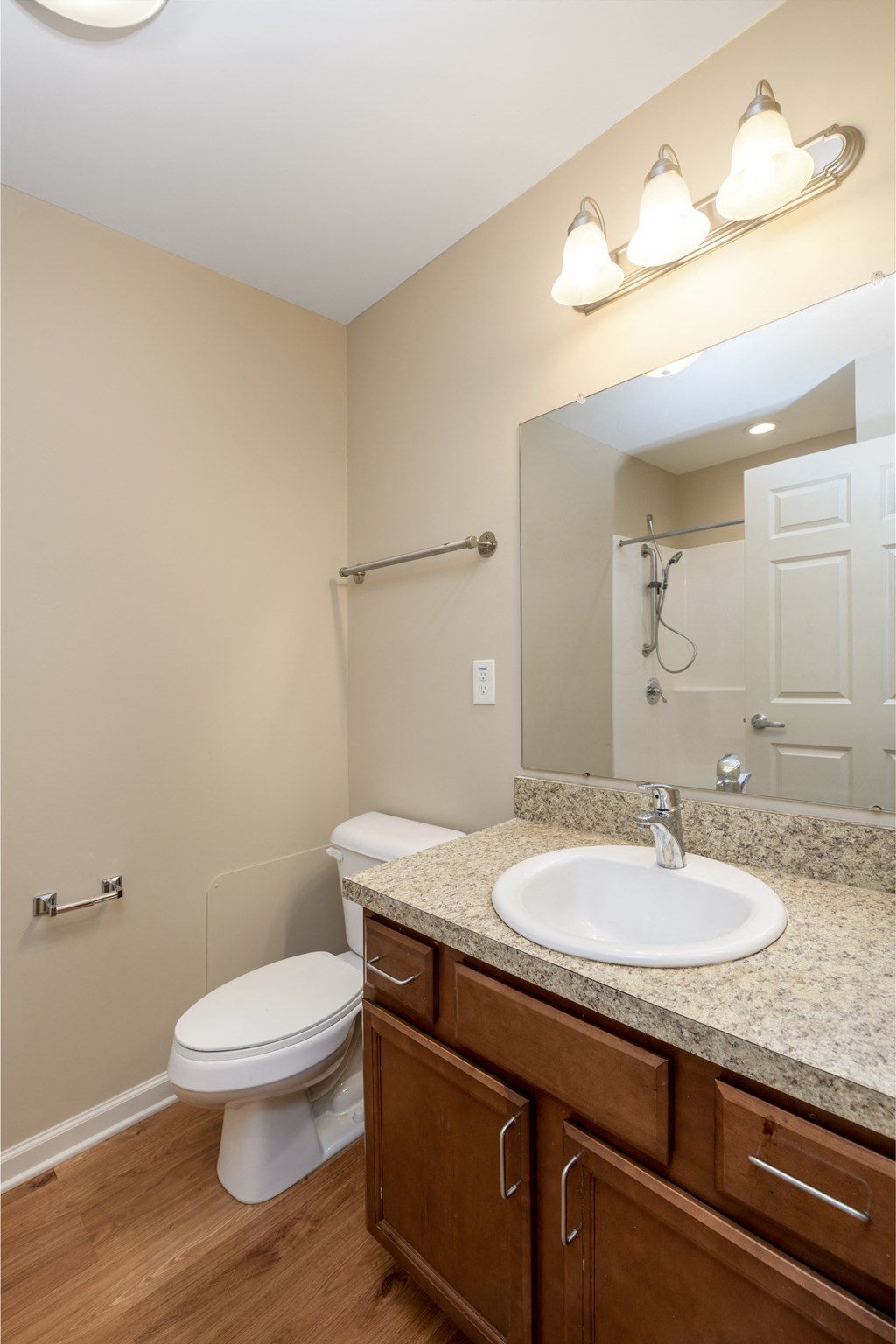 a bathroom with a sink toilet and a mirror