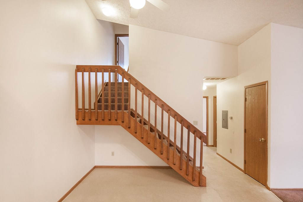 an open stairway in a home with a wooden
