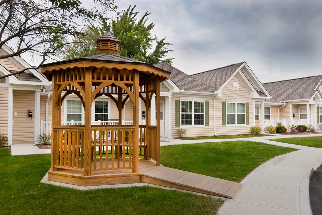 a gazebo in the front yard of a home