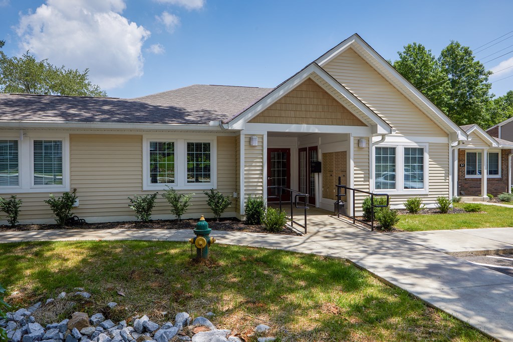 a house with a fire hydrant in front of it