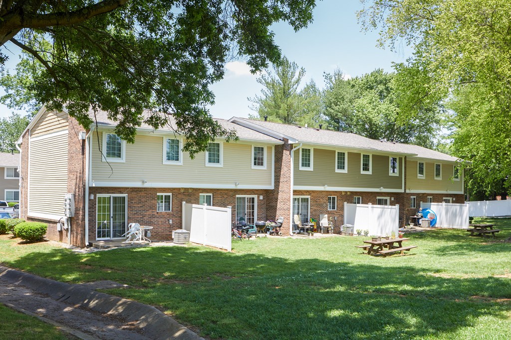 a large house with a yard in front of it