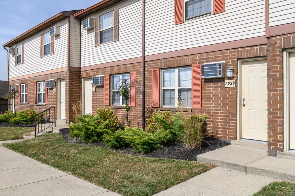a brick and with a sidewalk in front of it