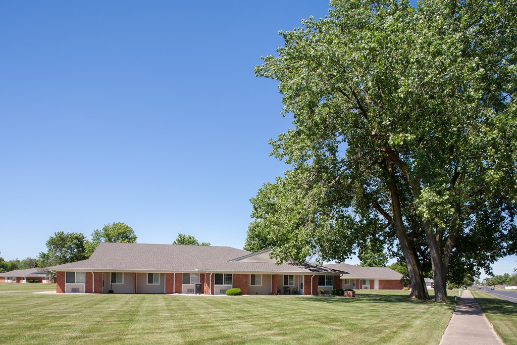 a house with a large tree in front of it