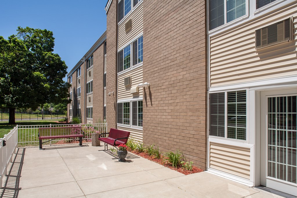 our apartments at the district feature a private patio with a bench