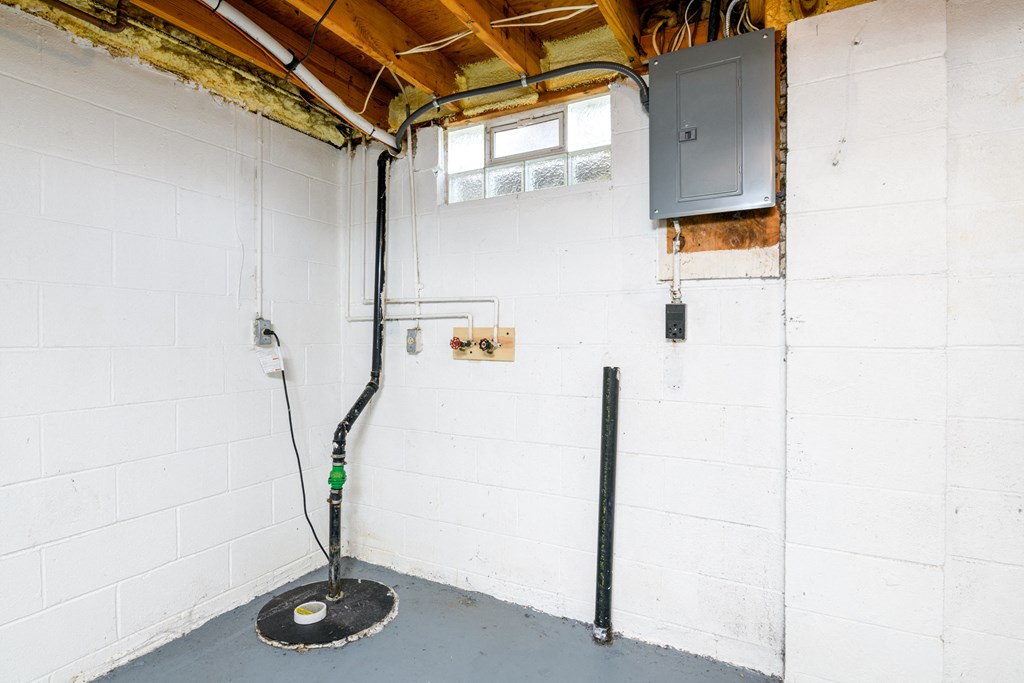 the inside of a building with pipes in the wall