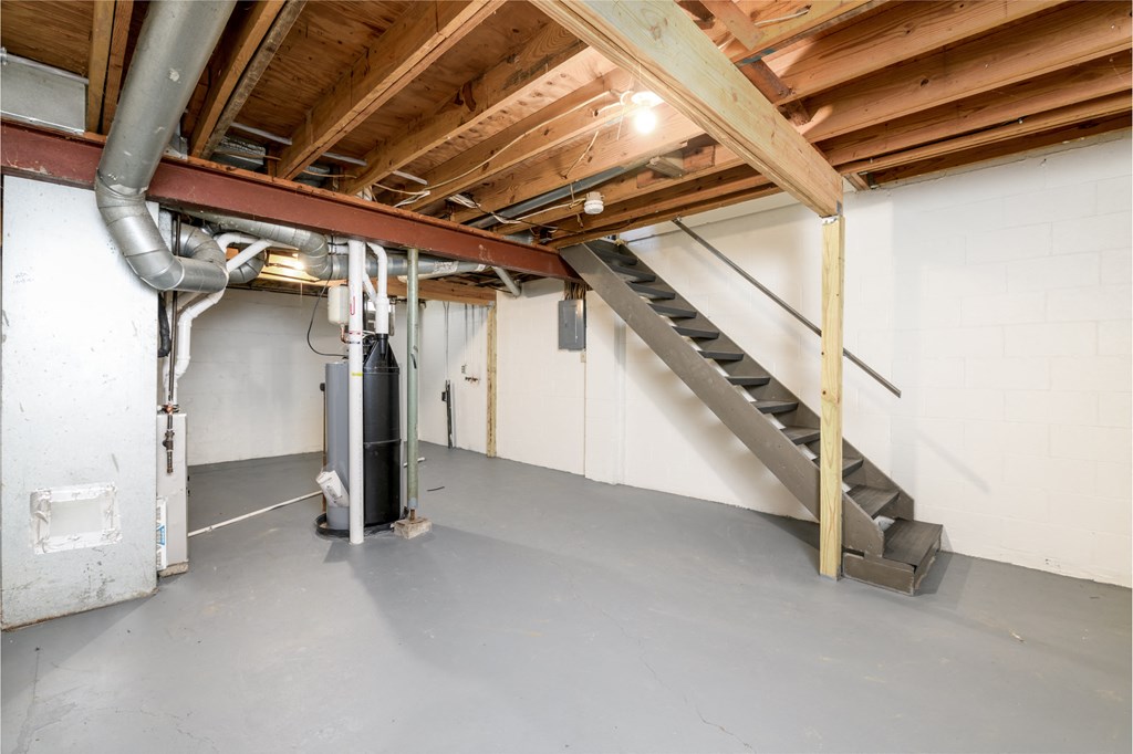 the basement of a house with a staircase in it