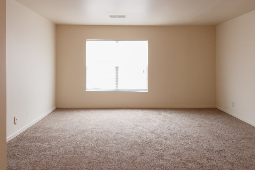 an empty room with a window in it