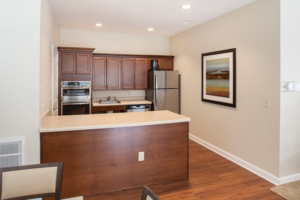 a kitchen with a counter top and a refrigerator