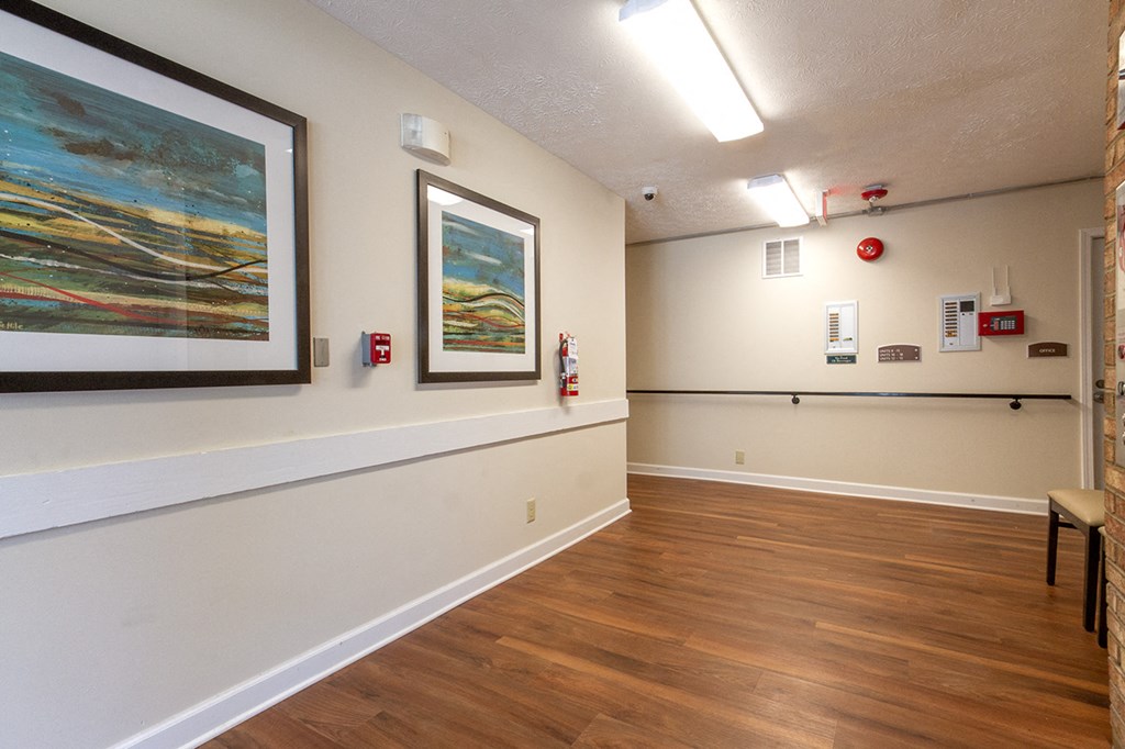 the preserve at ballantyne commons community room with wood floors and paintings