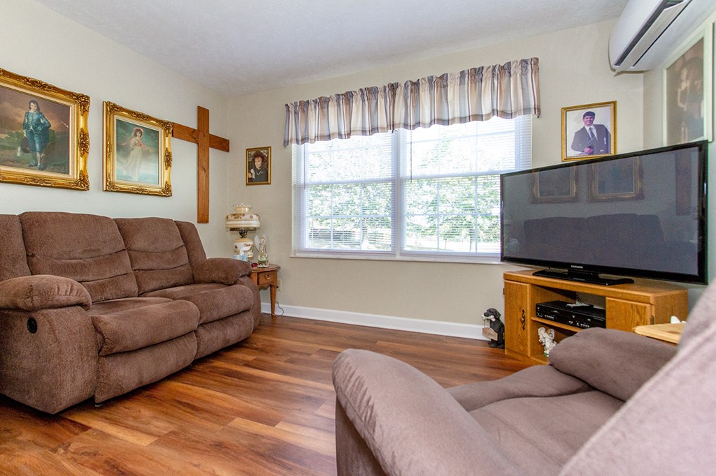a living room with a couch and a tv
