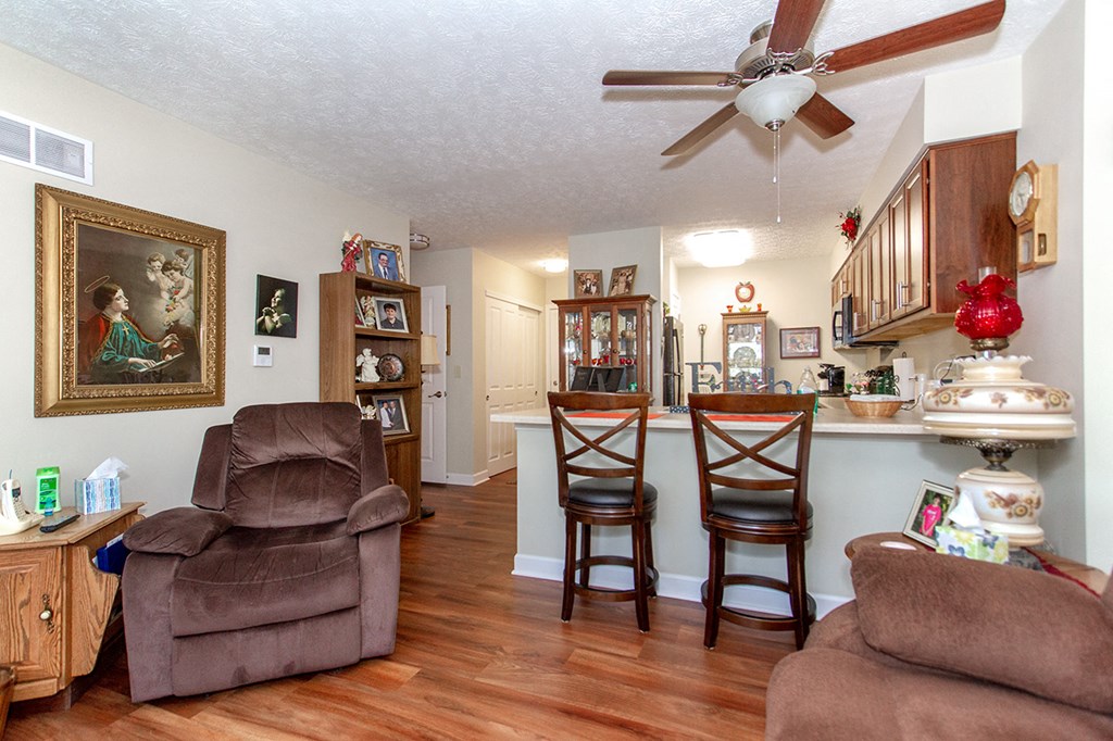 the living room and kitchen are open to the dining area and living room with a