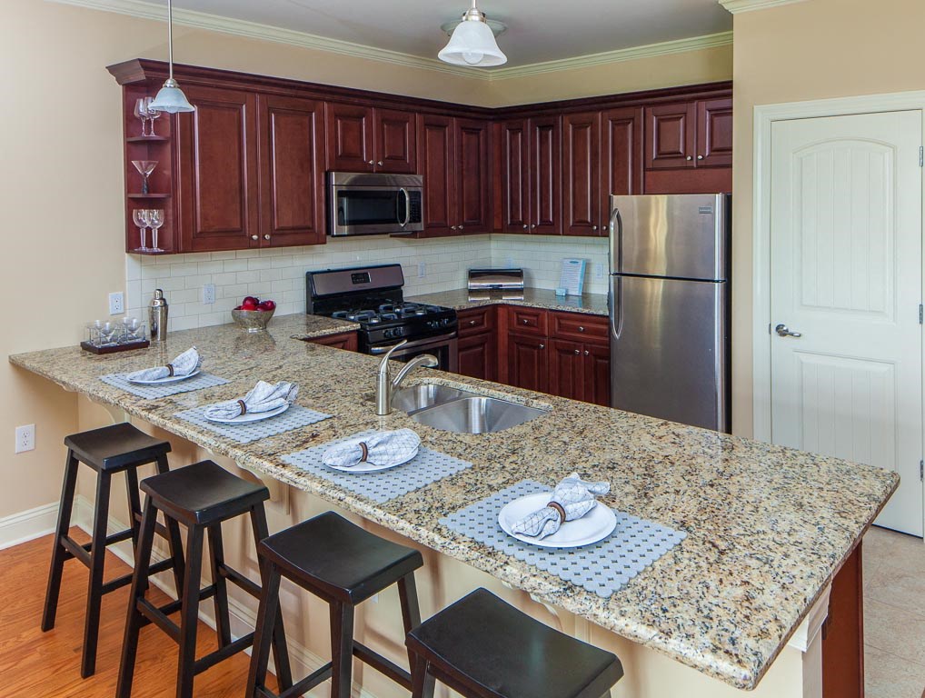 a kitchen with a granite counter top