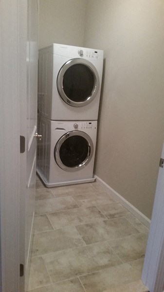 a washer and dryer in a small laundry room