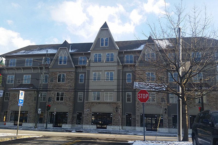 a stop sign in front of a large building