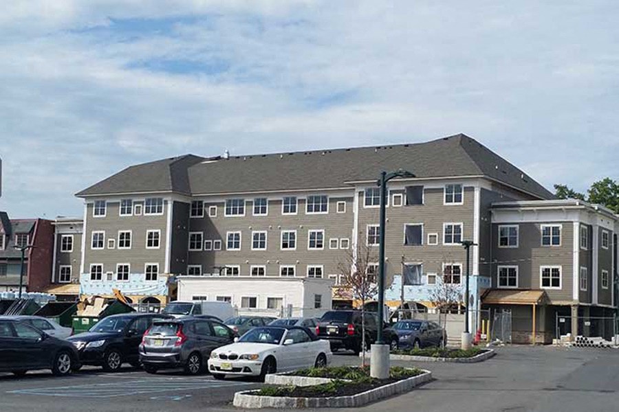 a parking lot with cars in front of a building