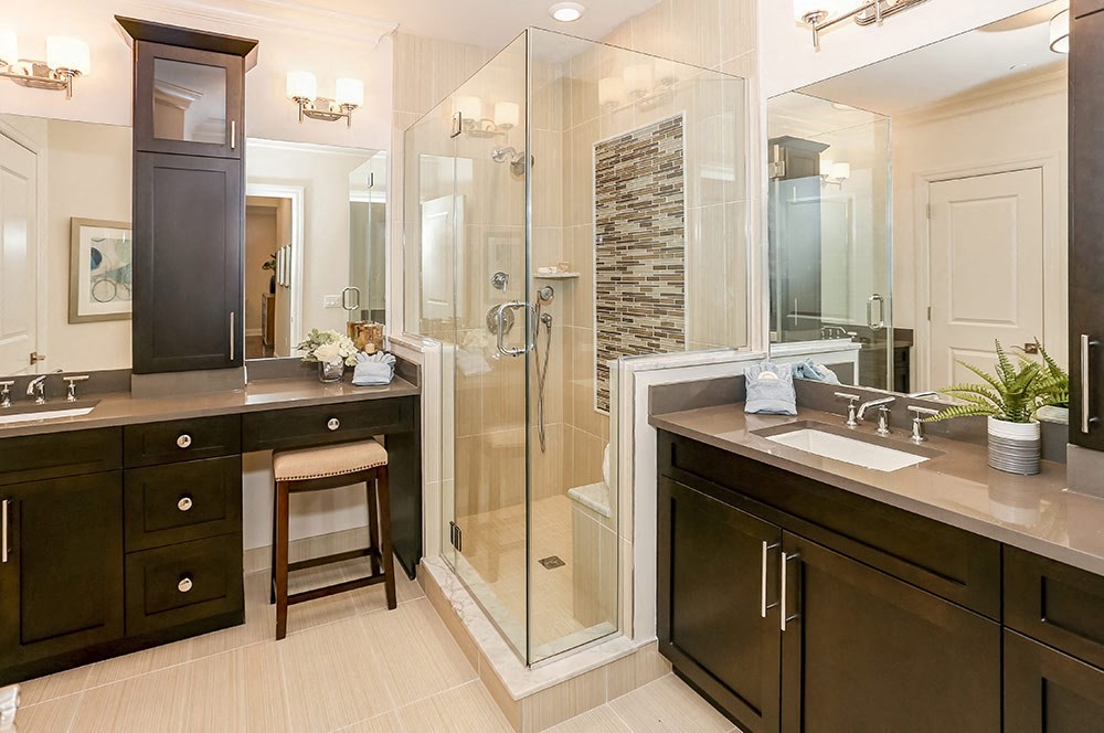 a bathroom with two sinks and a shower
