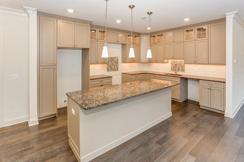 a kitchen with a large island in the middle