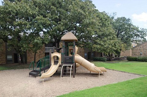 a childrens playground with a slide